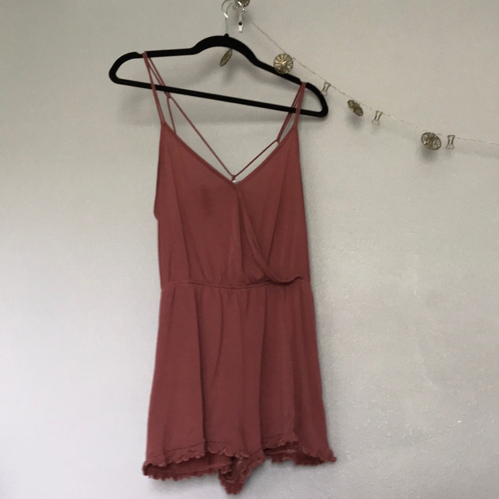 Blush romper with ruffle hem